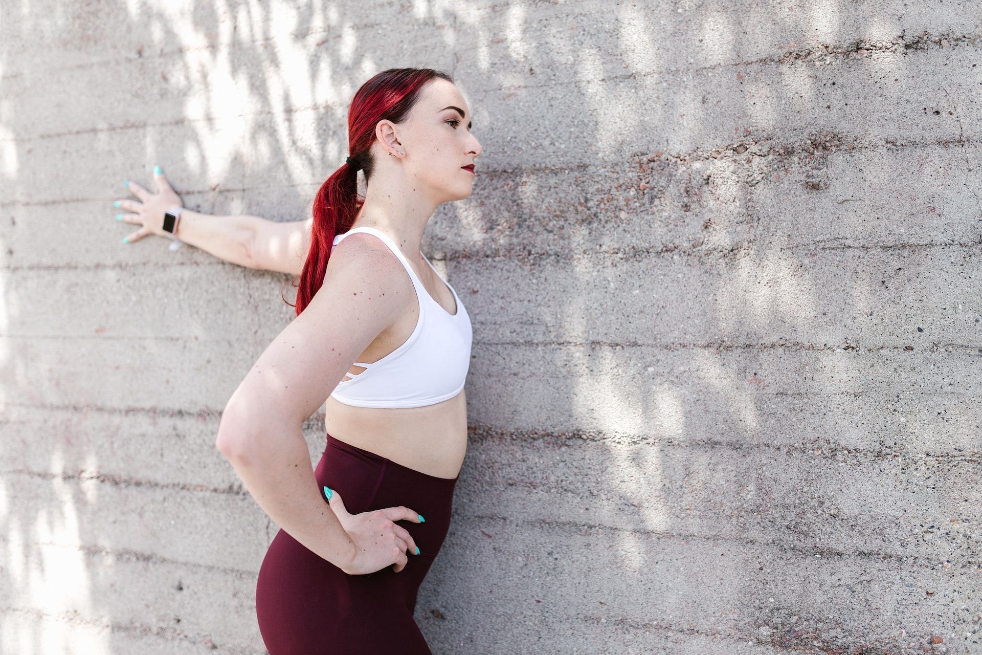 Wall stretch loosens tight pec minor muscles. (Photo via Pexels/RDNE Stock project)